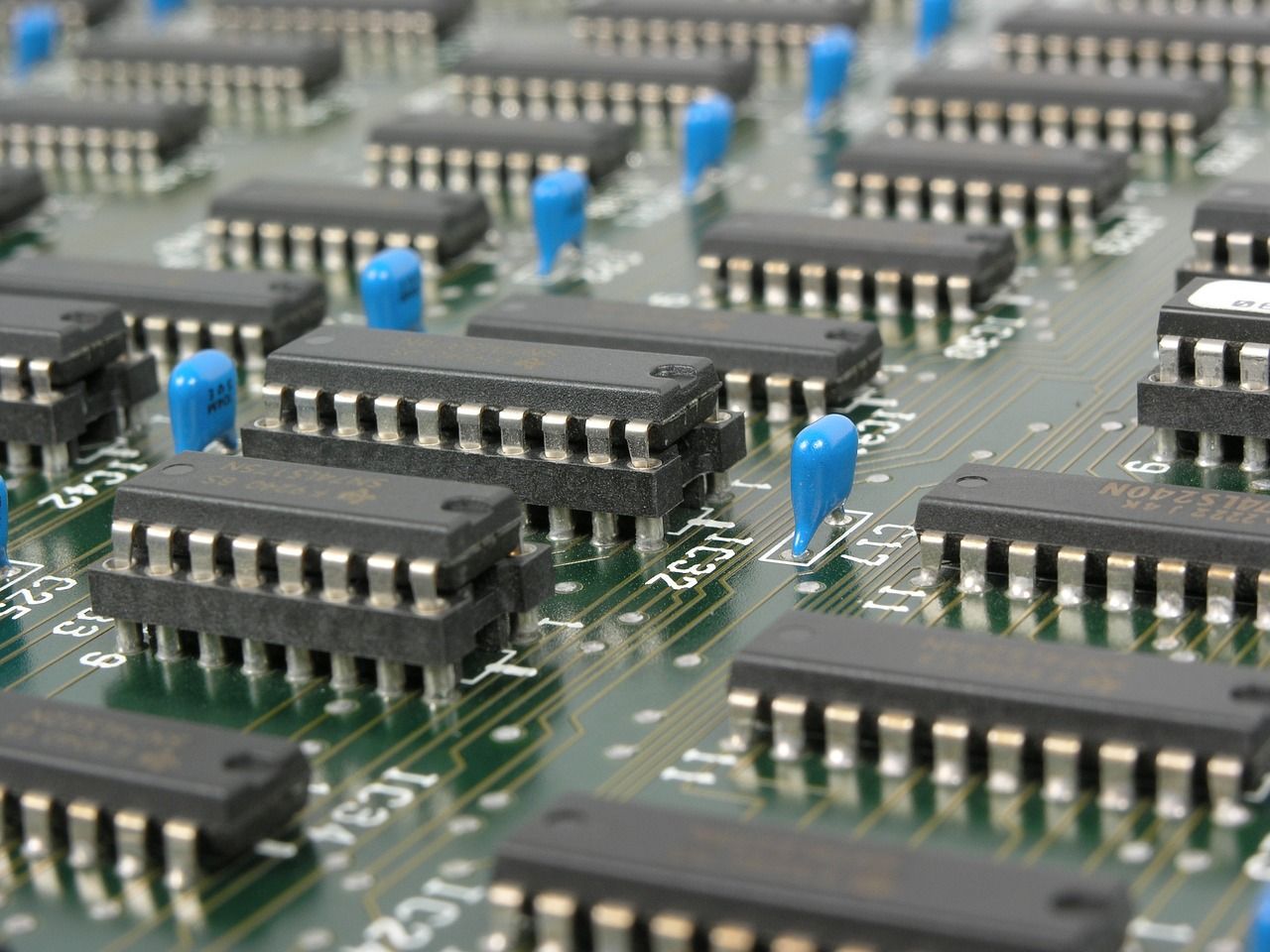 Decorative symbol photo shows electronic circuits of a motherboard.